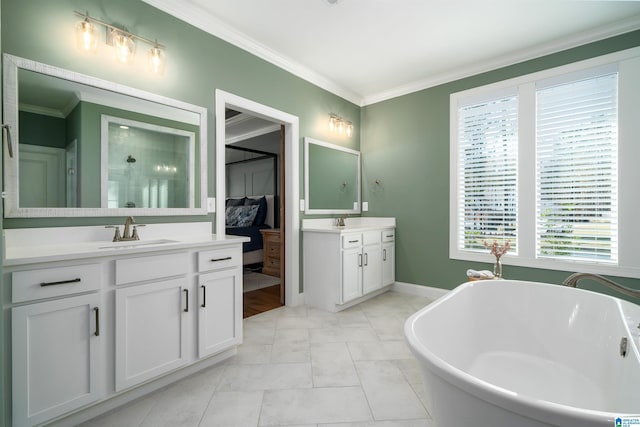 bathroom featuring a tub to relax in, crown molding, tile patterned flooring, and vanity