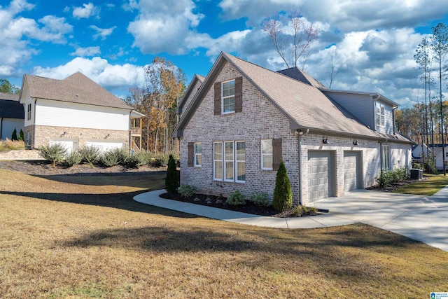 view of home's exterior featuring a yard and a garage