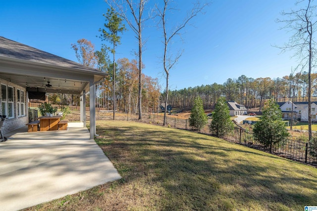 view of yard with a patio and ceiling fan