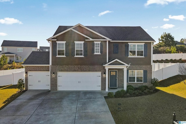 view of front of house featuring a garage and a front lawn