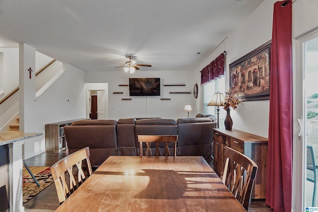 dining area featuring ceiling fan and dark wood-type flooring