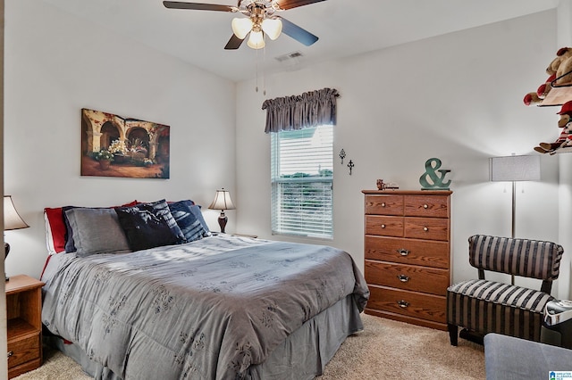 bedroom with ceiling fan and light colored carpet