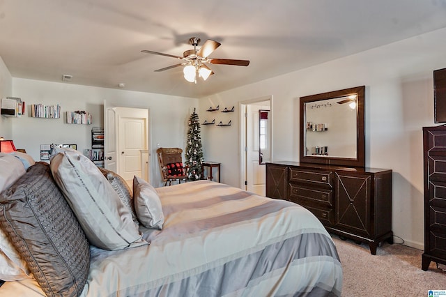 bedroom featuring ceiling fan and light colored carpet