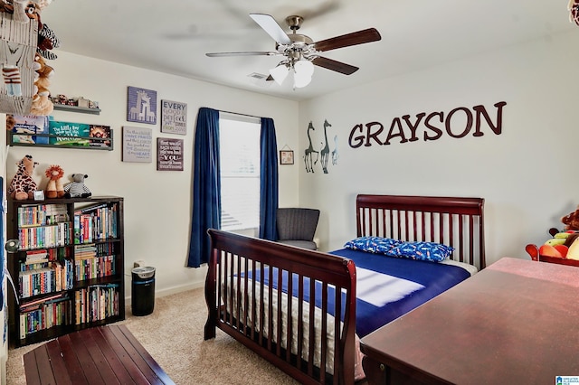 carpeted bedroom with ceiling fan