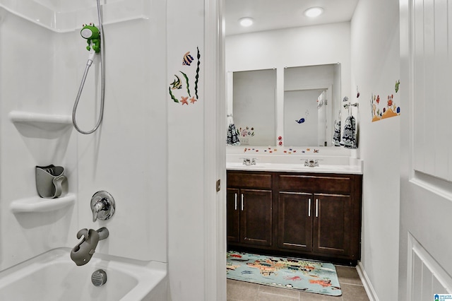 bathroom with vanity, tile patterned floors, and tub / shower combination