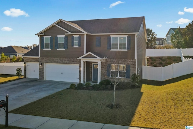 view of front of home with a front yard and a garage