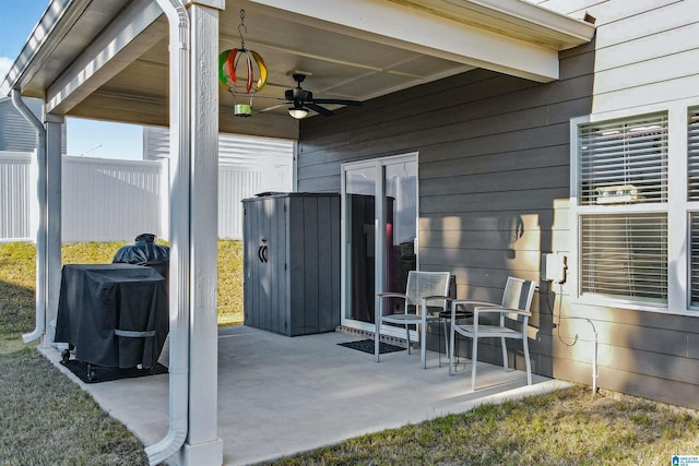 view of patio with area for grilling and ceiling fan