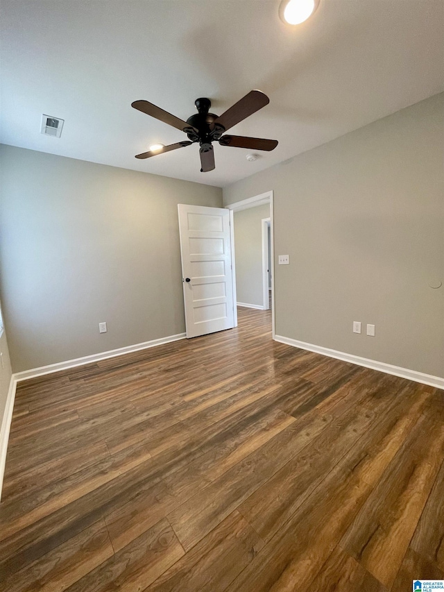 1304 3rd St SE, Cullman, AL 35055 - unfurnished room with ceiling fan and dark wood-type flooring