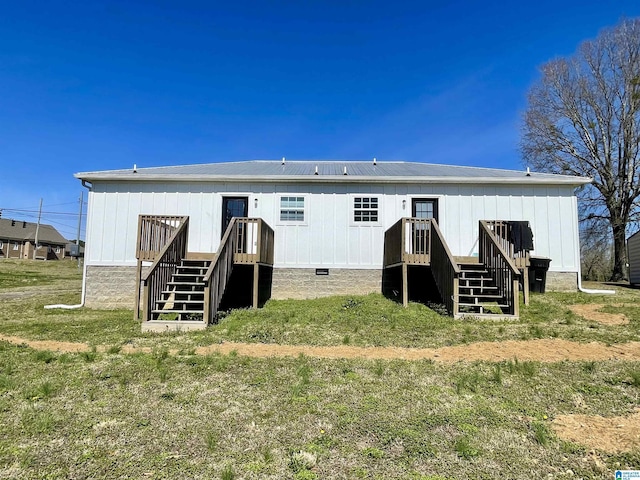 1304 3rd St SE, Cullman, AL 35055 - rear view of house featuring a yard