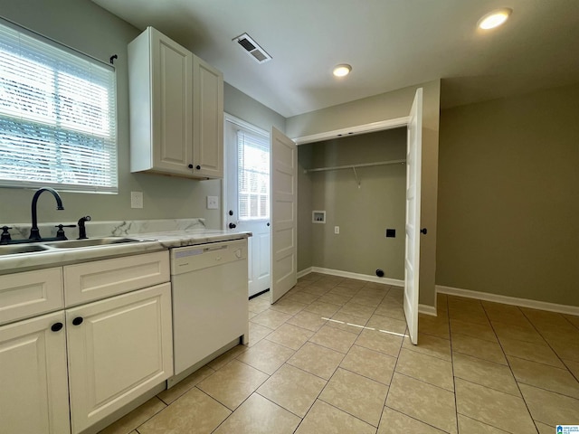 1304 3rd St SE, Cullman, AL 35055 - kitchen featuring white cabinetry, sink, white dishwasher, and light tile patterned flooring
