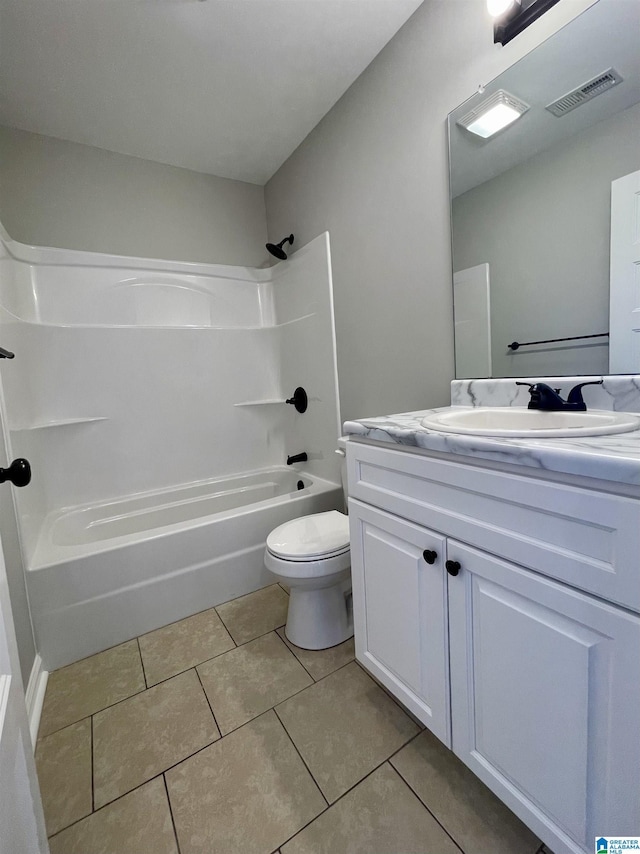 1304 3rd St SE, Cullman, AL 35055 - full bathroom featuring tile patterned flooring, vanity, toilet, and washtub / shower combination
