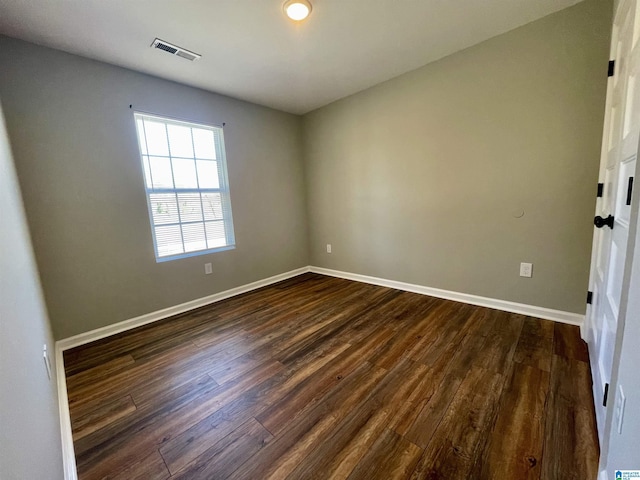 1304 3rd St SE, Cullman, AL 35055 - spare room with dark hardwood / wood-style floors