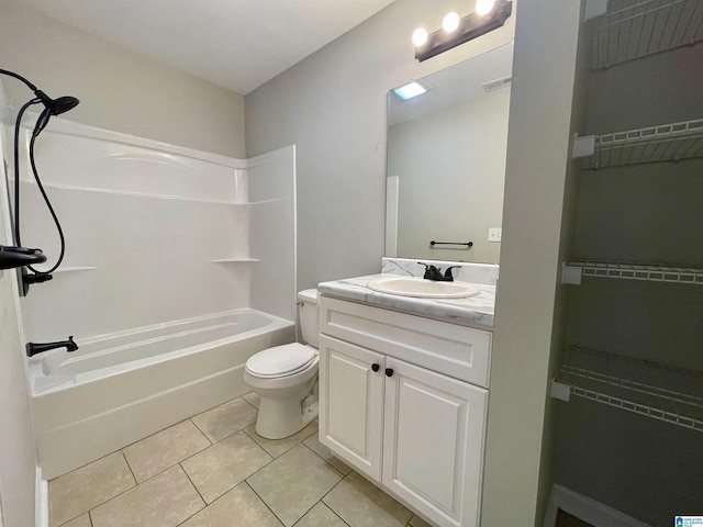 1314 3rd St, Cullman, AL 35055 - full bathroom with tile patterned floors, vanity, toilet, and shower / bathing tub combination