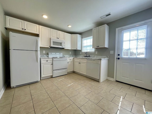 1314 3rd St, Cullman, AL 35055 - kitchen with white cabinetry, white appliances, sink, and a wealth of natural light