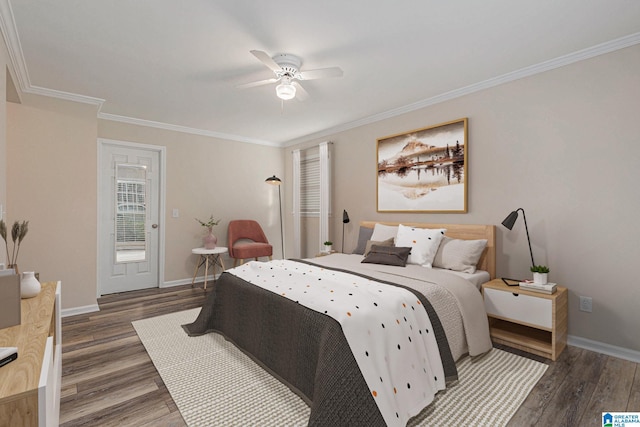 bedroom featuring dark hardwood / wood-style floors, ceiling fan, and ornamental molding