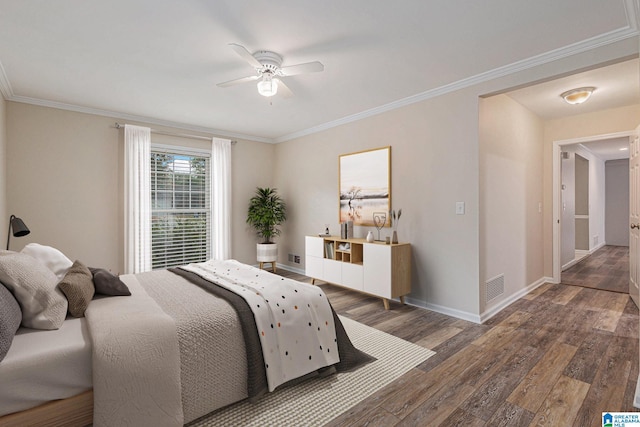 bedroom featuring ceiling fan, crown molding, and dark wood-type flooring