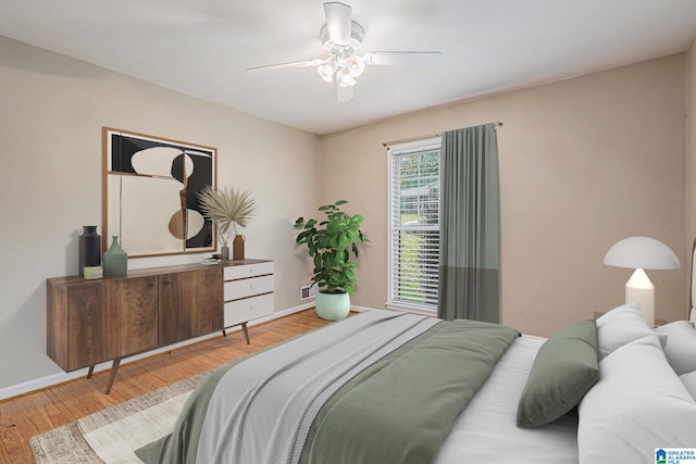 bedroom featuring light wood-type flooring and ceiling fan