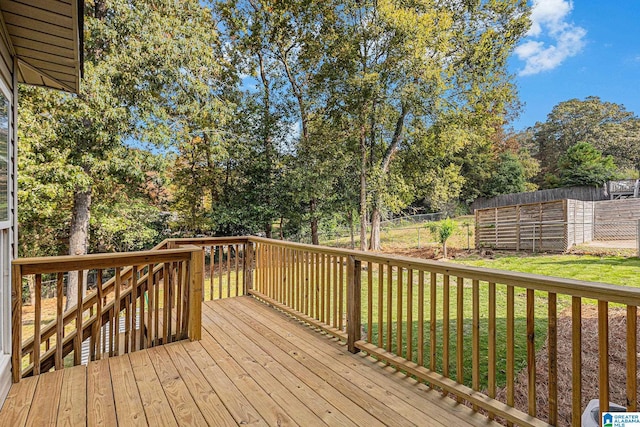 wooden terrace with a yard