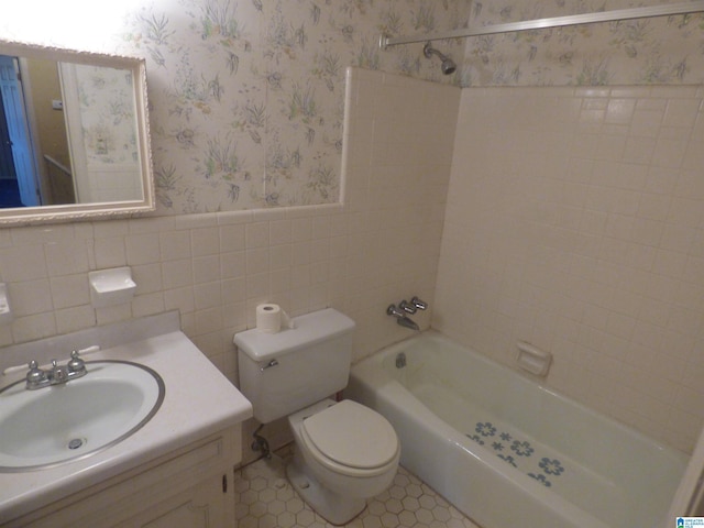 full bathroom featuring vanity, shower / tub combination, tile walls, tile patterned flooring, and toilet