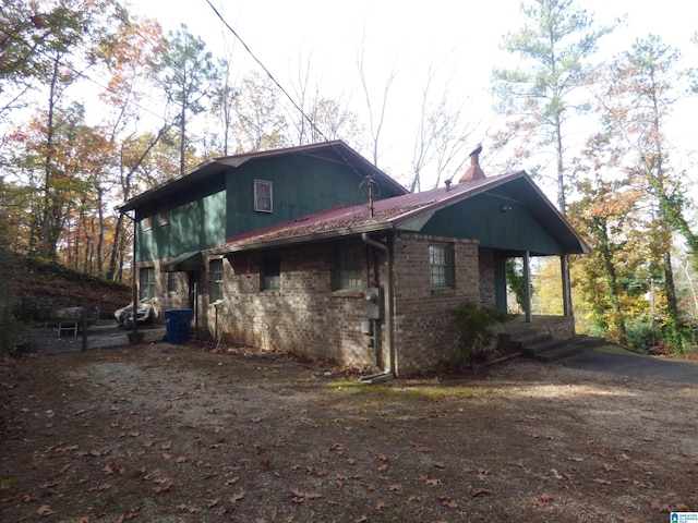 view of side of property with a porch