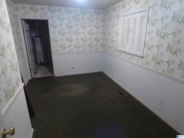 unfurnished room featuring gas water heater