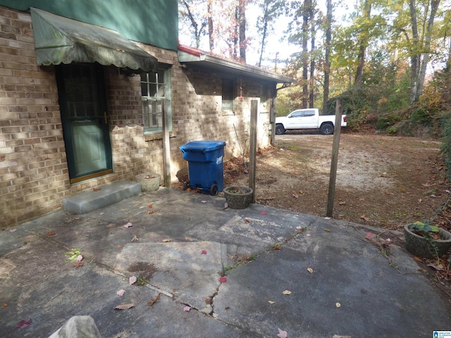 view of home's exterior with a patio area