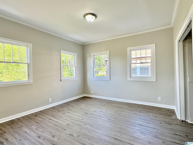 unfurnished bedroom featuring hardwood / wood-style floors and ornamental molding