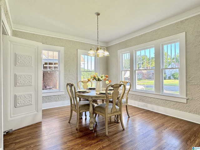 dining area featuring plenty of natural light, a chandelier, dark hardwood / wood-style floors, and ornamental molding