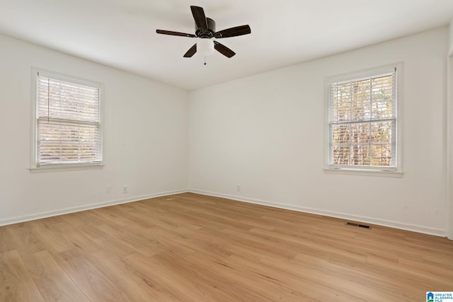 unfurnished room featuring ceiling fan and light hardwood / wood-style flooring