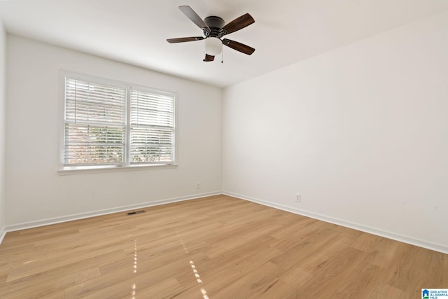 unfurnished room featuring ceiling fan and light wood-type flooring