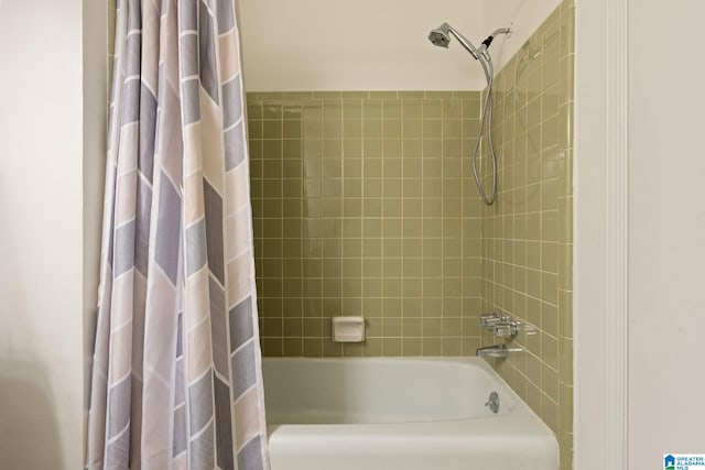 bathroom featuring shower / bathtub combination with curtain