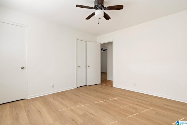 spare room featuring ceiling fan and light wood-type flooring