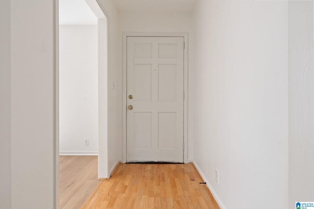 corridor featuring light hardwood / wood-style flooring