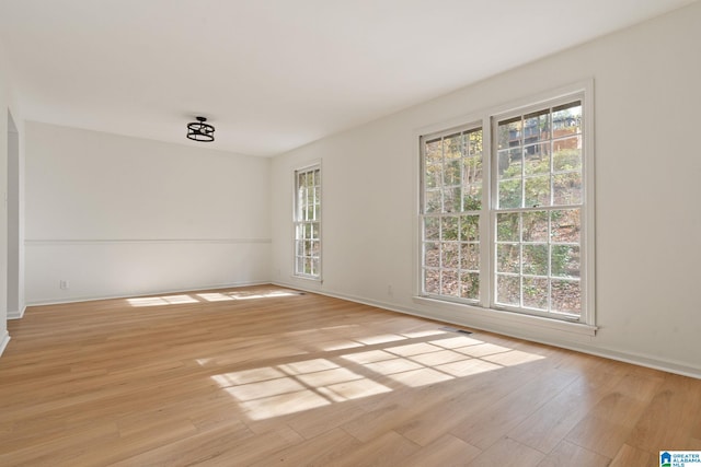 unfurnished room featuring light wood-type flooring