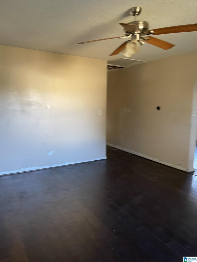 spare room featuring dark wood-type flooring