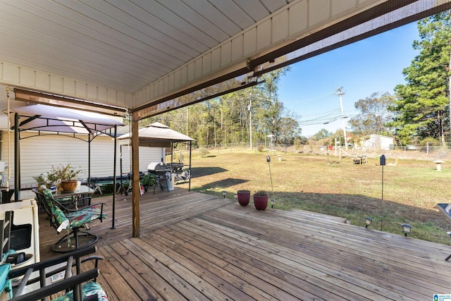 deck with a gazebo and a lawn