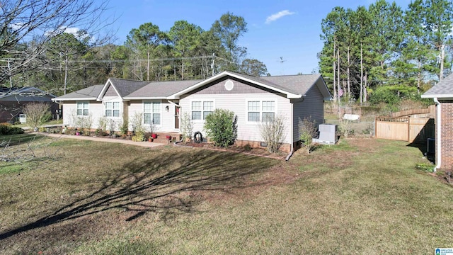 ranch-style home featuring a front yard