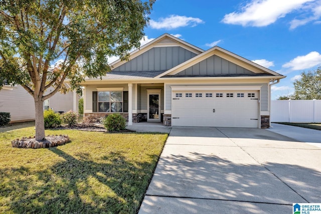 craftsman-style home with a garage and a front lawn