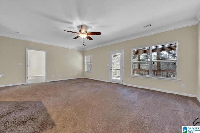 spare room with ceiling fan, carpet floors, and crown molding