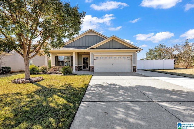 craftsman inspired home featuring a front yard and a garage