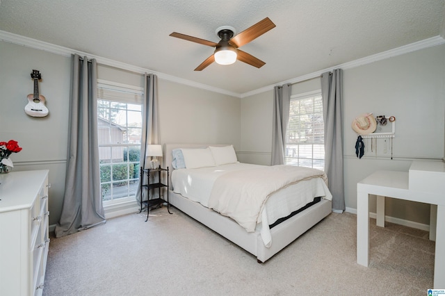 carpeted bedroom with ceiling fan, a textured ceiling, and multiple windows