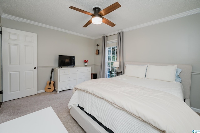 bedroom featuring light carpet, a textured ceiling, ceiling fan, and crown molding