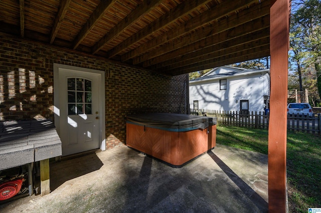 view of patio / terrace with a hot tub