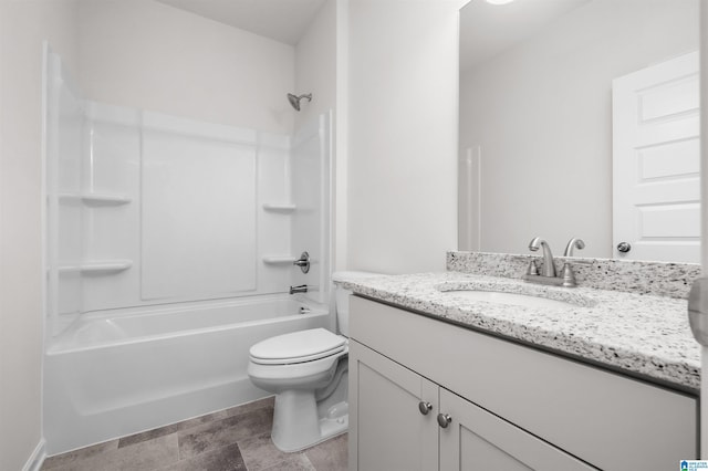 full bathroom with vanity, washtub / shower combination, and toilet