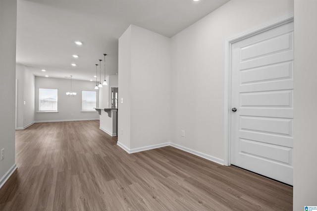 interior space with light hardwood / wood-style flooring and a chandelier