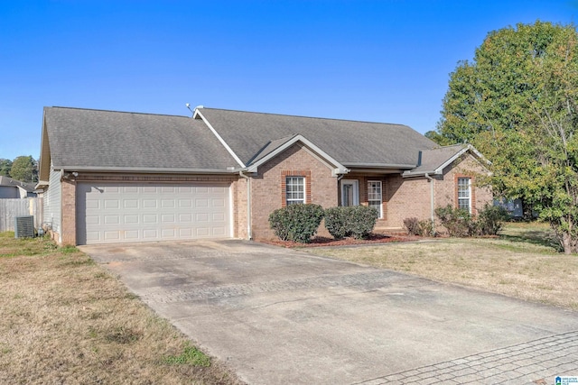 ranch-style house with a front lawn, a garage, and central AC