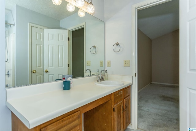 bathroom featuring vanity and a textured ceiling