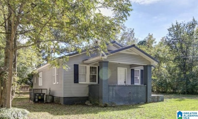 view of home's exterior with a lawn