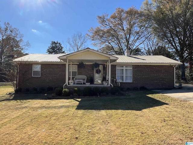 ranch-style house with a porch and a front lawn