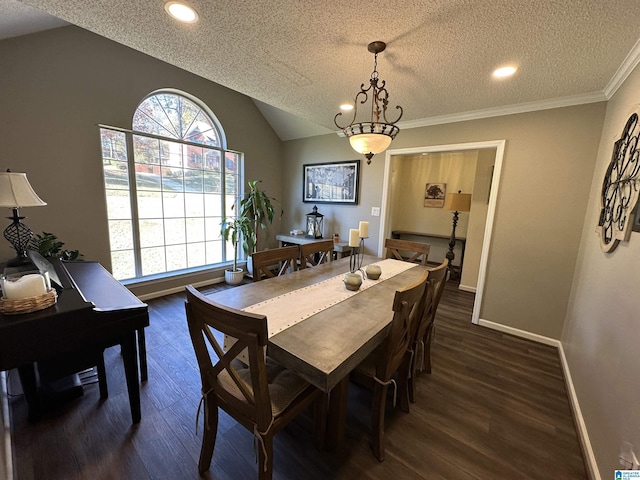 dining room featuring vaulted ceiling, crown molding, dark wood-type flooring, and a textured ceiling